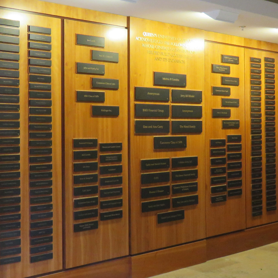 A wall with many plaques on it